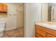 Bright bathroom featuring step-in shower, vanity with storage, and toilet at 1000 Strobus Ct, Wendell, NC 27591