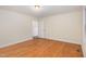 A bright and spacious bedroom with wood floors and a view of the outside at 1000 Strobus Ct, Wendell, NC 27591