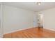 Spacious and bright bedroom featuring wood floors, neutral walls, and a view of the outside at 1000 Strobus Ct, Wendell, NC 27591
