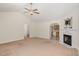 Inviting living room featuring a decorative fireplace and seamless access to the adjacent kitchen area at 1000 Strobus Ct, Wendell, NC 27591