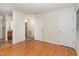 Bright main bedroom with hardwood floors, bathroom access, and neutral paint at 1000 Strobus Ct, Wendell, NC 27591