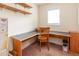 Well-lit office space equipped with a corner desk and built-in shelving at 1000 Strobus Ct, Wendell, NC 27591