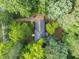 Aerial view of the home surrounded by mature trees at 10317 Roadstead W Way, Raleigh, NC 27613