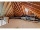 Spacious attic with exposed wooden beams, HVAC equipment, and ample storage space at 10317 Roadstead W Way, Raleigh, NC 27613