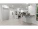 Kitchen features island with seating, white cabinets, and stainless steel appliances at 10317 Roadstead W Way, Raleigh, NC 27613