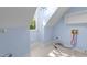 Bright laundry room with blue accent walls, hardwood floors and a window offering a view to the backyard at 10317 Roadstead W Way, Raleigh, NC 27613