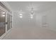 Bright living room with neutral paint and wood look floors and stylish sconces at 10317 Roadstead W Way, Raleigh, NC 27613