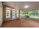 Covered patio featuring a wooden deck and multiple windows for ample natural light at 10317 Roadstead W Way, Raleigh, NC 27613