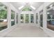 Bright sunroom with vaulted ceiling and lots of windows providing great natural light at 10317 Roadstead W Way, Raleigh, NC 27613