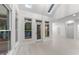 Sunroom with vaulted ceiling, lots of windows and french door leading to an outdoor deck at 10317 Roadstead W Way, Raleigh, NC 27613