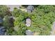 Aerial view of the home nestled among lush trees in a quiet residential neighborhood at 104 Tutbury Pl, Cary, NC 27519