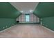 This bright and spacious bonus room features built-in shelving for maximum storage at 104 Tutbury Pl, Cary, NC 27519