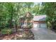 Traditional brick home with a two-car garage, front yard landscaping and a curved driveway at 104 Tutbury Pl, Cary, NC 27519
