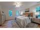 Relaxing main bedroom with neutral tones, hardwood floors, and bright natural light at 104 Tutbury Pl, Cary, NC 27519