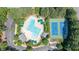 Aerial view of the community pool and tennis courts, surrounded by landscaped green spaces at 104 Tutbury Pl, Cary, NC 27519