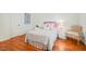Bedroom with a queen bed, hardwood floors, neutral paint and natural light at 10540 Byrum Woods Dr, Raleigh, NC 27613