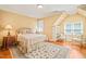Comfortable bedroom with rug, hardwood floors, and great natural light at 10540 Byrum Woods Dr, Raleigh, NC 27613