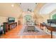 Upstairs bonus room with seating, desk and large window at 10540 Byrum Woods Dr, Raleigh, NC 27613