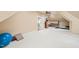 Spacious bonus room featuring neutral walls and carpet, exercise equipment, and a door to an adjacent room at 10540 Byrum Woods Dr, Raleigh, NC 27613