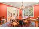 Spacious dining room featuring an elegant chandelier and arched entry to the foyer at 10540 Byrum Woods Dr, Raleigh, NC 27613