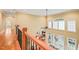 Open concept foyer with views to the lower level living room and a grand arched window at 10540 Byrum Woods Dr, Raleigh, NC 27613