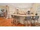 Gourmet kitchen with a large island, seating, and stainless steel appliances at 10540 Byrum Woods Dr, Raleigh, NC 27613
