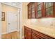 Kitchen with marble countertop and dark wood cabinets at 10540 Byrum Woods Dr, Raleigh, NC 27613