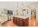 Well-equipped kitchen with a center island and updated appliances at 10540 Byrum Woods Dr, Raleigh, NC 27613