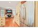 Spacious kitchen with stainless steel refrigerator and seamless flow to the living room at 10540 Byrum Woods Dr, Raleigh, NC 27613