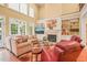 Inviting living room featuring a fireplace, built-in shelving, and ample seating at 10540 Byrum Woods Dr, Raleigh, NC 27613