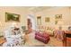 Cozy living room featuring crown molding, arched entry, and hardwood floors at 10540 Byrum Woods Dr, Raleigh, NC 27613