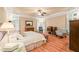 Spacious main bedroom with tray ceiling, plantation shutters, and hardwood floors at 10540 Byrum Woods Dr, Raleigh, NC 27613
