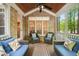 Covered patio features comfortable seating options and a brick accent wall at 10540 Byrum Woods Dr, Raleigh, NC 27613