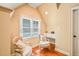Charming sitting area features hardwood floors, natural light from the window, and two chairs with a vanity at 10540 Byrum Woods Dr, Raleigh, NC 27613