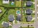 Aerial view of home with a swimming pool, playground, and spacious backyard at 109 Obsidian Dr, Holly Springs, NC 27540