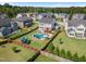 Aerial view of a backyard featuring a pool with slide and playground equipment. Deck, patio, and fencing add to the appeal at 109 Obsidian Dr, Holly Springs, NC 27540