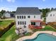 Aerial view of the home's patio, deck and pool in the backyard at 109 Obsidian Dr, Holly Springs, NC 27540