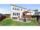 Back of home featuring a deck, patio, fire pit, and ample outdoor seating at 109 Obsidian Dr, Holly Springs, NC 27540