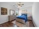 Comfortable bedroom showcases a neutral color scheme, wood floors, and ample natural light at 109 Obsidian Dr, Holly Springs, NC 27540