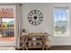 Dining area with view to outdoor deck and featuring a decorative clock and shelving at 109 Obsidian Dr, Holly Springs, NC 27540
