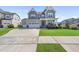 Charming two-story home with a well-maintained lawn, two car garage, and inviting front porch at 109 Obsidian Dr, Holly Springs, NC 27540