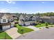 Well-manicured home boasts a three-car garage and lush green lawn at 109 Obsidian Dr, Holly Springs, NC 27540
