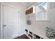 This mudroom features built in bench, storage, and hooks for organization at 109 Obsidian Dr, Holly Springs, NC 27540