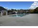 Community pool and pool house in residential area with leafy trees at 109 Obsidian Dr, Holly Springs, NC 27540