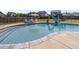 Refreshing in-ground pool with slide, surrounded by a fenced backyard at 109 Obsidian Dr, Holly Springs, NC 27540