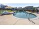 Inviting in-ground pool with a slide and lounge chairs for relaxing at 109 Obsidian Dr, Holly Springs, NC 27540