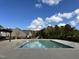 Community pool with basketball hoop and clear blue sky on a sunny day at 109 Obsidian Dr, Holly Springs, NC 27540