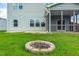 Enjoy this well-maintained backyard with a stone fire pit feature for gatherings at 1104 Arden Trace Ct, Fuquay Varina, NC 27526