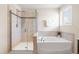 Bathroom featuring a walk-in shower and a large soaking tub by the window at 1104 Arden Trace Ct, Fuquay Varina, NC 27526