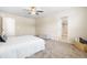 Spacious bedroom featuring carpet, neutral walls, and an attached bathroom at 1104 Arden Trace Ct, Fuquay Varina, NC 27526